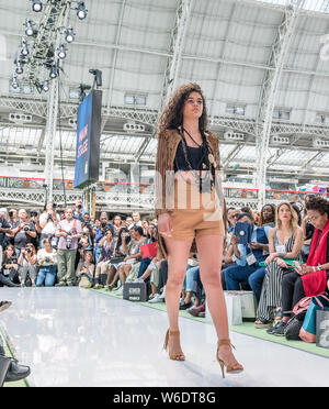 21 July 2019 - London. UK Pure London SS20 catwalk runway event, model walking back.