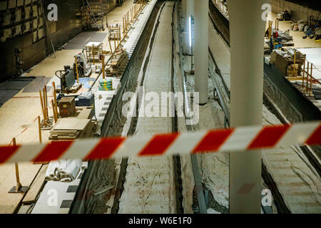 Berlin, Germany. 01st Aug, 2019. A warning tape secures a construction site for the future underground line U5 at the U5 info station in front of the Red Town Hall. Credit: Carsten Koall/dpa/Alamy Live News Stock Photo