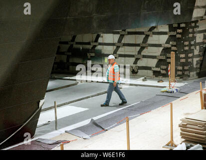 Berlin, Germany. 01st Aug, 2019. A construction worker is walking on a construction site of the future subway line U5 at the U5 info station in front of the Rotes Rathaus. Credit: Carsten Koall/dpa/Alamy Live News Stock Photo