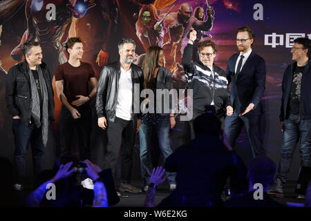 American actor and singer Robert Downey Jr., left, and English actor Tom Hiddleston attend a press conference for new movie 'Avengers: Infinity War' i