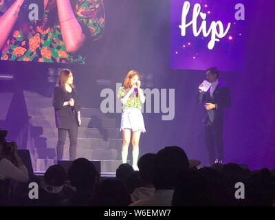 South Korean singer and dancer Kim Hyun-ah, better known by the mononym Hyuna, stylized as HyunA, center, weeps as she is touched by fans during a fan Stock Photo