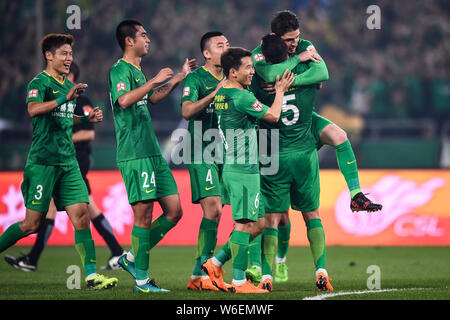 Beijing Guoan players celebrate a goal during the 29th round of the ...