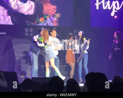 South Korean singer and dancer Kim Hyun-ah, better known by the mononym Hyuna, stylized as HyunA, second left, interacts with fans during a fan meetin Stock Photo