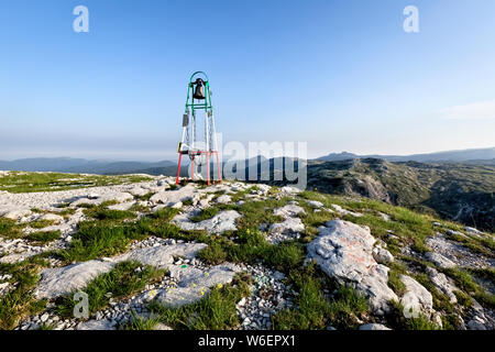 The bell on the top of Mount Ortigara remembers the bloody battles of the Great War. Asiago plateau, Vicenza province, Veneto, Italy, Europe. Stock Photo