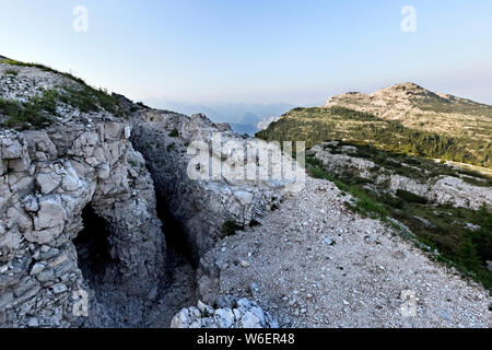 Mount Ortigara: Austro-Hungarian trenches and shelters of the Great War carved into the rock. Asiago plateau, Vicenza province, Veneto, Italy, Europe. Stock Photo