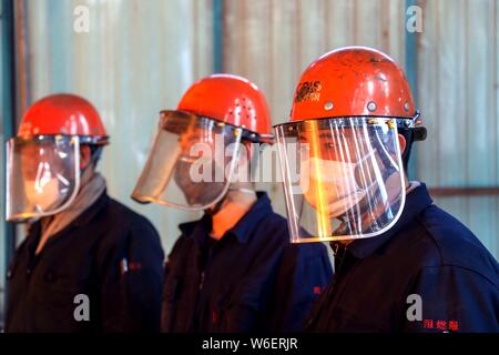 --FILE--Chinese workers survey the production of steel at a plant of Qingdao Special Iron and Steel Co., Ltd. in Qingdao city, east China's Shandong p