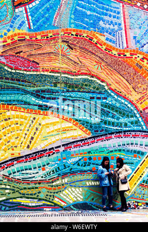 Visitors take photos in front of the colorful exterior facade of the Chongqing Luo Zhongli Art Museum on the Huxi Campus of Sichuan Fine Arts Institut Stock Photo