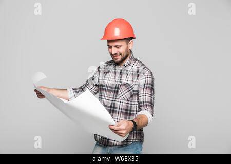 Architect looking into blueprints on white background Stock Photo