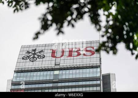 --FILE--A logo of Swiss bank UBS Group is pictured on the rooftop of an office building in Shanghai, China, 4 December 2017.   The Hong Kong authoriti Stock Photo