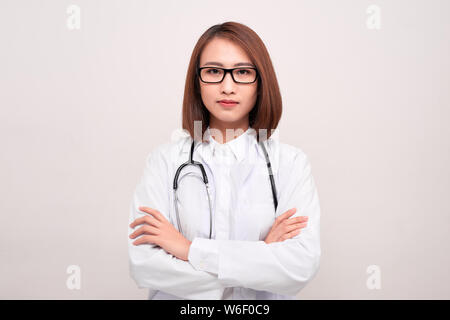 Cheerful happy doctor with crossed hands on white background Stock Photo