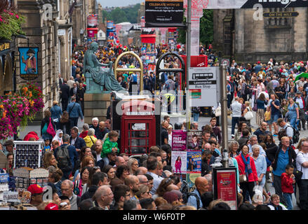 Edinburgh, Scotland, UK. 1 August 2019. Crowds of tourists throng the Lawnmarket and Royal Mile in the Old Town of Edinburgh on the eve of the start of the Edinburgh Festival. Overcrowding by tourists is a growing problem in the ancient city and locals complain it is harder to move around the city because of pedestrian congestion. Credit: Iain Masterton/Alamy Live News Stock Photo