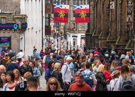 Edinburgh, Scotland, UK. 1 August 2019. Crowds of tourists throng the Lawnmarket and Royal Mile in the Old Town of Edinburgh on the eve of the start of the Edinburgh Festival. Overcrowding by tourists is a growing problem in the ancient city and locals complain it is harder to move around the city because of pedestrian congestion. Credit: Iain Masterton/Alamy Live News Stock Photo
