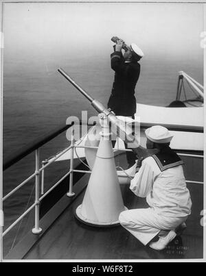 Anti-aircraft gun practice. Photo taken on one of the converted yachts now being used in the Naval Reserve.; General notes:  Use War and Conflict Number 481 when ordering a reproduction or requesting information about this image. Stock Photo