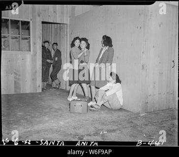 Arcadia, California. Impromptu dancing at Santa Anita assembly center for evacuees of Japanese ance . . .; Scope and content:  The full caption for this photograph reads: Arcadia, California. Impromptu dancing at Santa Anita assembly center for evacuees of Japanese ancestry. Evacuees are transferred later to War Relocation Authority centers for the duration. Stock Photo