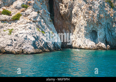 Seascape view to turquoise waters of Aegean Sea in Island Moni near Athens, blue caves. Famous travel sailing destination Greece, Saronic gulf summer Stock Photo