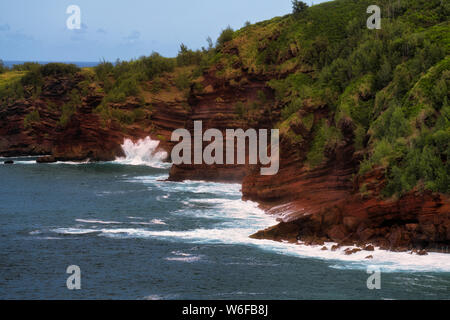 Storm driven waves smash against the lava shoreline at Nakalele Point on Hawaii’s Island of Maui. Stock Photo