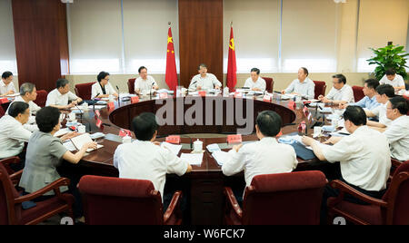 (190801) -- BEIJING, Aug. 1, 2019 (Xinhua) -- Chen Xi, a member of the Political Bureau of the Communist Party of China (CPC) Central Committee and deputy chief of the leading group of the Party's education campaign themed 'staying true to our founding mission', presides over a meeting with representatives from the campaign's central instructing groups in Beijing, capital of China, Aug. 1, 2019. (Xinhua/Huang Jingwen) Stock Photo