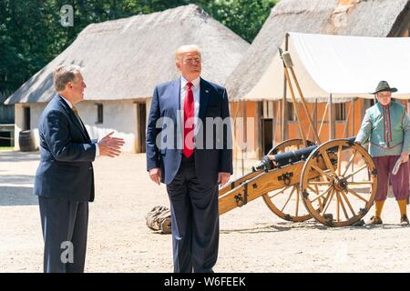 U.S President Donald Trump tours the James Fort replica with Philip Emerson, Executive Director of the James-Yorktown Foundation, at Jamestown Settlement Museum July 30, 2019 in Williamsburg, Virginia. Stock Photo