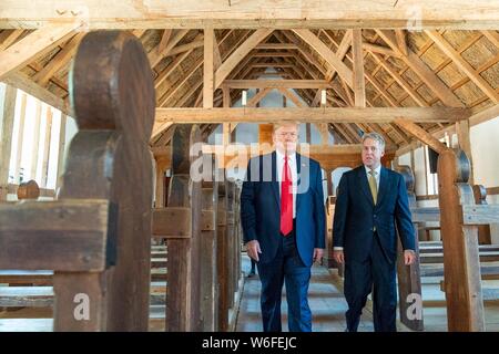 U.S President Donald Trump tours a church building with Philip Emerson, Executive Director of the James-Yorktown Foundation, at Jamestown Settlement Museum July 30, 2019 in Williamsburg, Virginia. Stock Photo