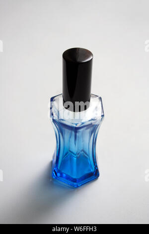 Ultramarine blue glass perfume bottle isolated on white background Stock Photo