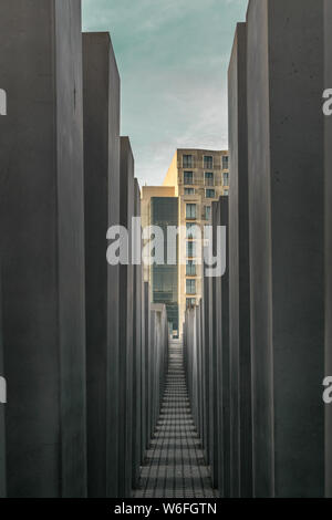 BERLIN, GERMANY - SEPTEMBER 26, 2018: Memorial to the Murdered Jews of Europe, with a focus in a building at the end of the path Stock Photo