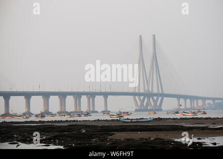 The image of Fishing boats and Worli bandra sealink bridge, at Mumbai, India Stock Photo