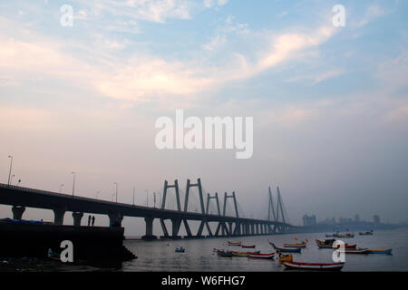 The image of Fishing boats and Worli bandra sealink bridge, at Mumbai, India Stock Photo