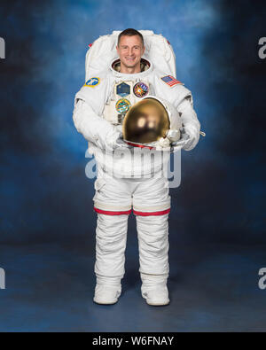 International Space Station Expedition astronaut Andrew Morgan NASA poses for his official portrait wearing a U.S. spacesuit, also known as an Extravehicular Mobility Unit at the Johnson Space Center April 30, 2019 in Houston, Texas. Stock Photo