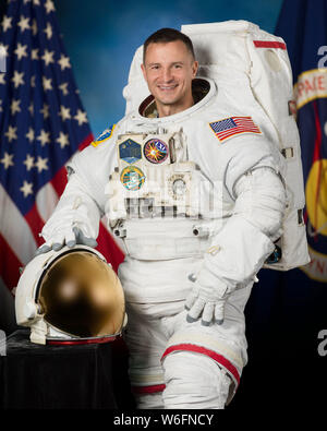 International Space Station Expedition astronaut Andrew Morgan NASA poses for his official portrait wearing a U.S. spacesuit, also known as an Extravehicular Mobility Unit at the Johnson Space Center April 30, 2019 in Houston, Texas. Stock Photo