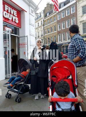 London, England, UK. Muslim family, women wearing headscarves Stock Photo
