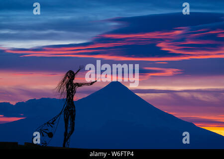 Zoom shot of beautiful sunrise colors on the shore of Lake Llanquihue with the unmistaken Osorno volcano in the background Stock Photo