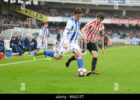 Real Sociedad's midfielder Mikel Oyarzabal vies for the ball with Athletic Club's defender Mikel San José (Credit Image: © Julen Pascual Gonzalez) Stock Photo