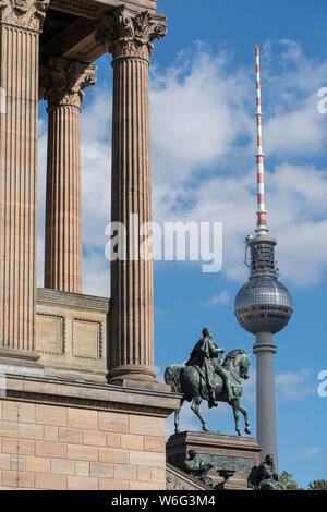 BERLIN, GERMANY - SEPTEMBER 26, 2018: Bright and contrasting view of the antique architecture of the Alte national galerie and the statue of it's Stock Photo