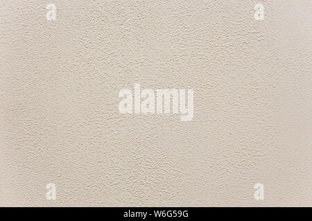Classic manually applied beige exterior plaster texture, Ground fine light plaster, Outdoor fine grain plaster. Stock Photo
