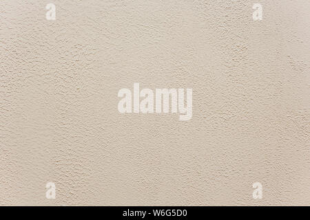 Classic manually applied beige exterior plaster texture, Ground fine light plaster, Outdoor fine grain plaster. Stock Photo