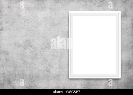 white picture frame on concrete wall - blank canvas mock up Stock Photo