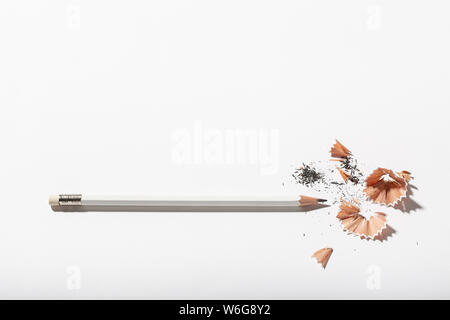 White Pencil with sharpening shavings on white background. Back to school concept. Copy space for text Stock Photo