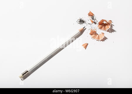 White Pencil with sharpening shavings on white background. Back to school concept. Copy space for text Stock Photo