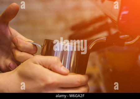 Close up of barista preparing fresh espresso on professional coffee machine Stock Photo