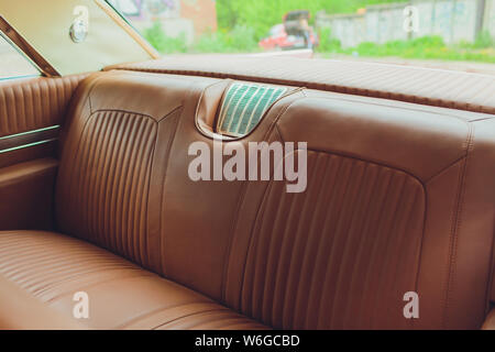 Old leather vintage car seat detail. interior of the old car. Stock Photo