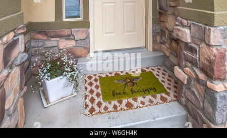 Panorama Entrance of a home with white wooden front door sidelight and transom window Stock Photo