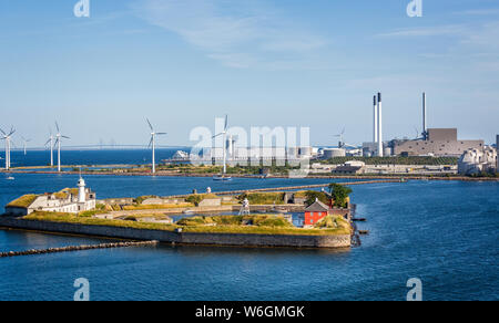 Offshore wind farm with Trekroner Fort in foreground and the Olesund bridge in the background in the Baltic Sea off the coast of Denmark on 18 July 20 Stock Photo