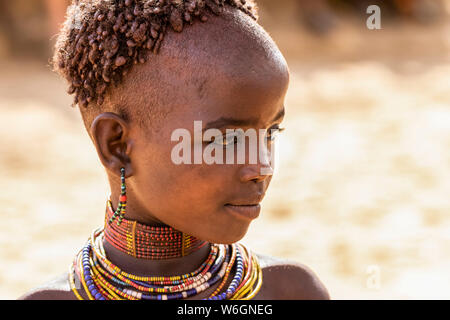 Hamer girl at a bull jumping ceremony, which initiates a boy into manhood, in the village of Asile; Omo Valley, Ethiopia Stock Photo