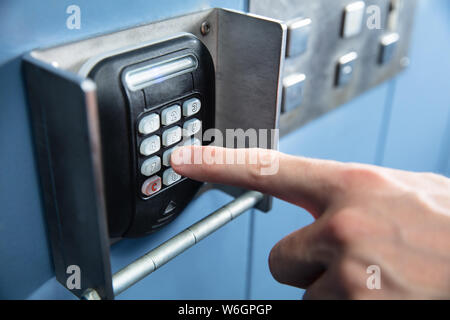 Close-up Of A Person 's Finger Pressing Entering Floor Code Inside Elevator Stock Photo