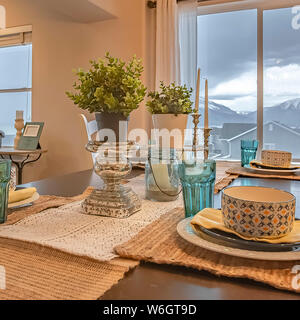Square frame Lovely dining setting with hemp table runner and placemats on the wooden table Stock Photo