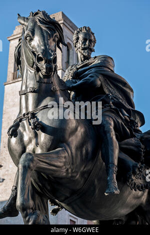 The big bronze equestrian statue beside of the Palazzo Gotico. The knight is represented Alessandro Farnese, the Duke of Parma and Piacenza. Stock Photo