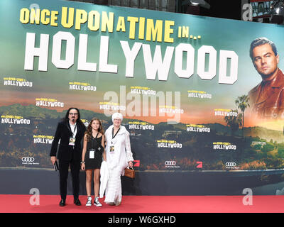 Berlin, Germany. 01st Aug, 2019. Producer George DiCaprio (l), father of actor Leonardo DiCaprio, the niece Normandy and his wife Peggy Ann Farrar (r) come to the premiere of the movie 'Once upon a time.in Hollywood'. The Hollywood production starts on 15.08.2019 in the German cinemas. Credit: Jens Kalaene/dpa-Zentralbild/dpa/Alamy Live News Stock Photo