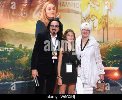 Berlin, Germany. 01st Aug, 2019. Producer George DiCaprio (l), father of actor Leonardo DiCaprio, the niece Normandy and his wife Peggy Ann Farrar (r) come to the premiere of the movie 'Once upon a time.in Hollywood'. The Hollywood production starts on 15.08.2019 in the German cinemas. Credit: Jens Kalaene/dpa-Zentralbild/dpa/Alamy Live News Stock Photo