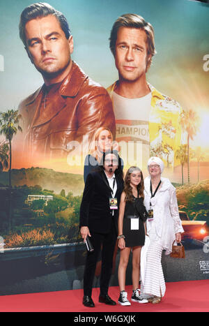 Berlin, Germany. 01st Aug, 2019. Producer George DiCaprio (l), father of actor Leonardo DiCaprio, the niece Normandy and his wife Peggy Ann Farrar (r) come to the premiere of the movie 'Once upon a time.in Hollywood'. The Hollywood production starts on 15.08.2019 in the German cinemas. Credit: Jens Kalaene/dpa-Zentralbild/dpa/Alamy Live News Stock Photo