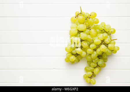Tasty green grapes. White grape on white table. Stock Photo